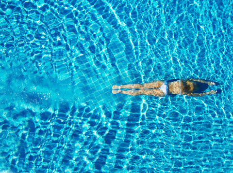 Swimmer training in an outdoor pool
