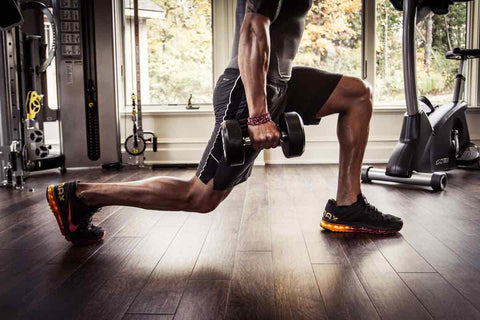 Man performing a dumbbell lunge